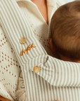 bamboo linen grey stripe baby clip carrier by chekoh australian owned and perfect for newborns and toddlers male babywearing model dad
