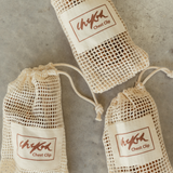Packaging of the Chekoh Chest Strap, a beige natural cotton mesh pouch with Chekoh Logo 