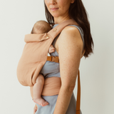 blush pink Baby Clip Carrier with adjustable waistband, soft and supportive. Australian designed for a lightweight and safe carry.