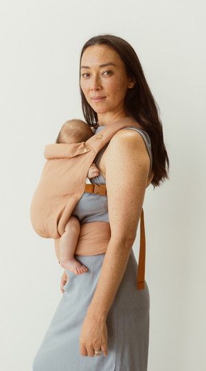 blush pink Baby Clip Carrier with adjustable waistband, soft and supportive. Australian designed for a lightweight and safe carry.