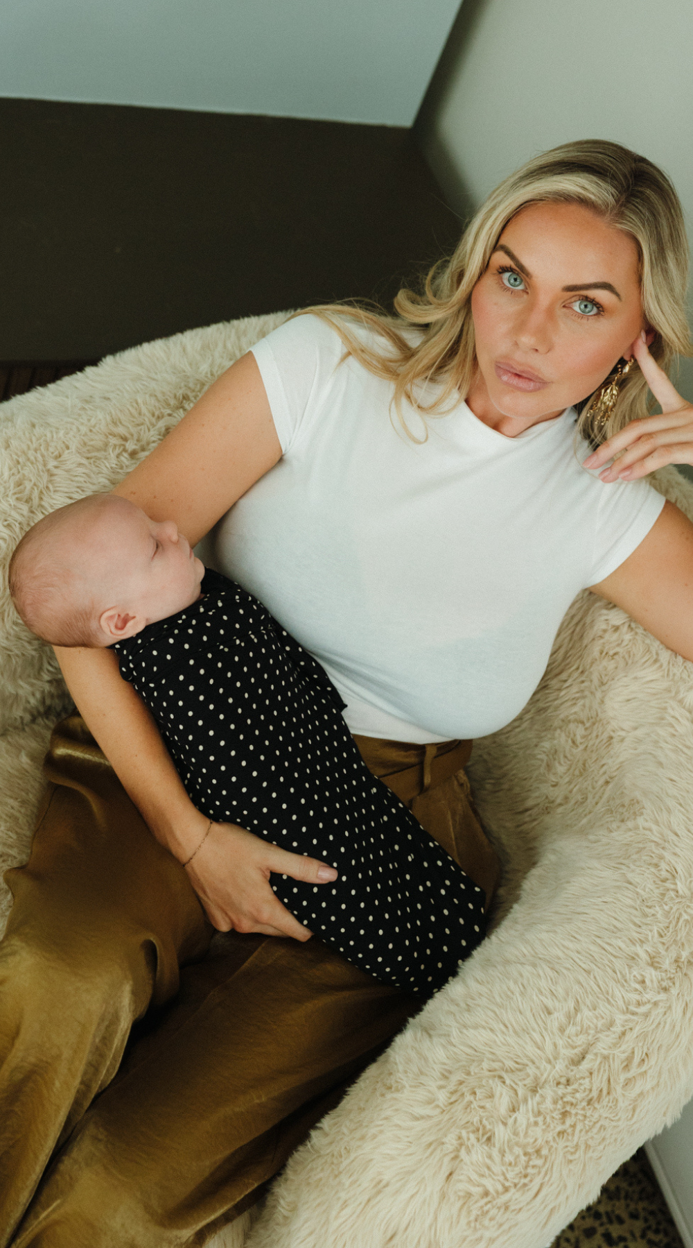 A sleeping baby is comfortable and content all swaddled up in a super soft Chekoh Baby Swaddle in the new Polka Dot print