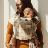 Chekoh Baby Carriers Newborn Wrap Carrier in Bandana print. Neutral colours in beige, cream and ochre for the most perfect style. 