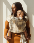 Chekoh Baby Carriers Newborn Wrap Carrier in Bandana print. Neutral colours in beige, cream and ochre for the most perfect style. 
