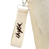 Close up of custom embroidered Chekoh Logo key ring that is detachable and featured on all storage pouches.