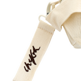 Close up of detachable embroidered Chekoh logo key ring - comes attached to the Clip Storage Bag.