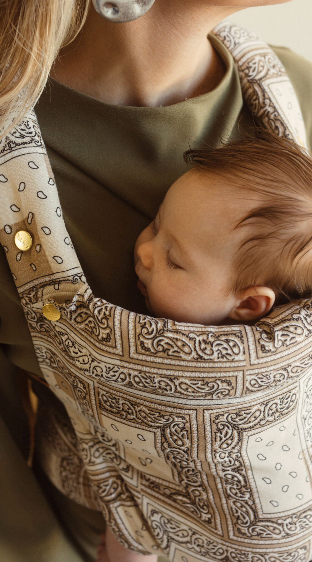 Chekoh Bandana print baby carrier, our new limited edition collection launch 2024. Neutral colours in a stylish bandana paisley print to wear your baby from newborn to toddler. Designed in Australia with super lightweight and cool bamboo and linen fabric blend. 