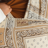 Chekoh Baby Carriers Newborn Wrap Carrier in Bandana print. Neutral colours in beige, cream and ochre for the most perfect style. 