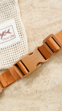 Close up of the Chekoh Chest Strap - including signature Chekoh golden brown strapping and buckle. Comes with a Cotton Mesh Storage Pouch.