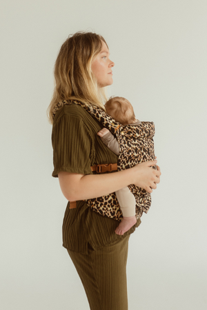 Keep your baby close and comfy in a Chekoh Leopard Clip Carrier 2.0 